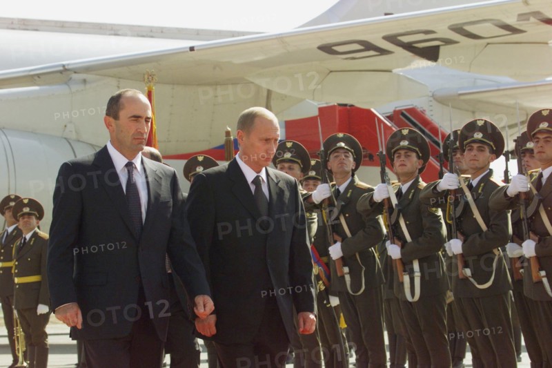 Russian president vladimir putin (r) and his armenian counterpart robert kocharyan (l) inspecting guard of honour upon the arrival of russian head of state at the airport of yerevan on friday sept, 14, 2001.