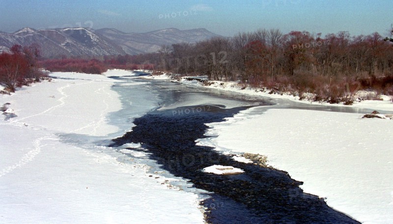 Maritime territory, far east, russia, march 2002, partizanskaya river in early spring.