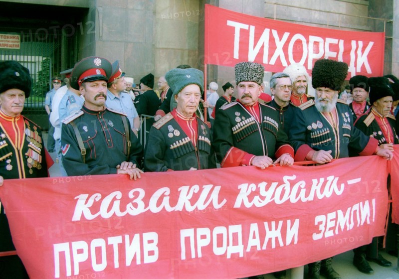 Moscow, russia, june 21 2002: some cossacks from the kuban area took part in the meeting the banner reads 'cossacks are against sale of land!', communists staged a meeting in front of the state duma to protest the possibility of sale of agricultural lands, the state duma was to discuss the bill on its plenary session today.
