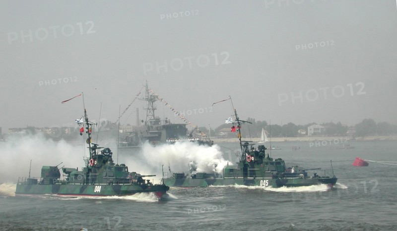 Russian navy day celebrations in astrakhan, russia, july 28, crews of the armoured boats (in pic) demonstrate their combat skills during the festivities on the occasion of the russian navy day, in astrakhan, where the chief caspian fleet's military base is dislocated, on sunday, russian navy commander-in-chief admiral vladimir kuroyedov and commander of the north-caucasus military district gennady troshev are taking part in the festivities.