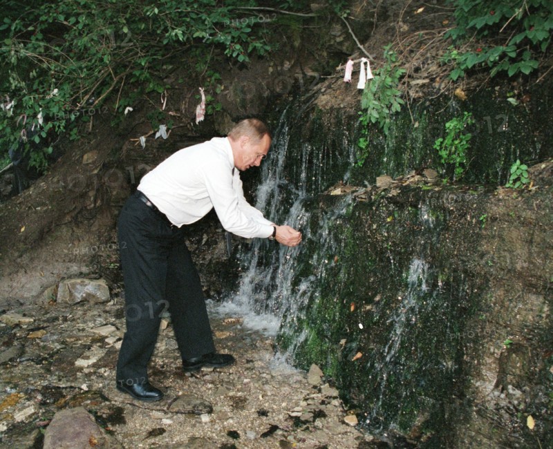 Russian president vladimir putin visitng an ancient fortress of izborsk near pskov, russia, in august 2002.