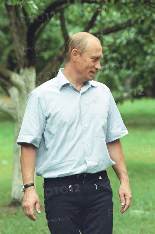 Russian president vladimir putin strolling in presidetnial residence novo-ogaryovo in july 2002.