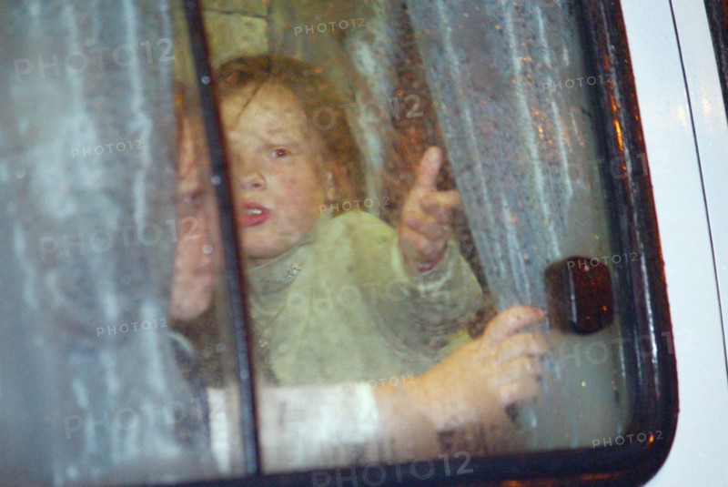 Moscow, russia, 10/23/02: some children (seen in a bus) were allowed to leave the building of the palace of culture of the ball-bearing plant which had been seized by terrorists, on wednesday, according to the hostages released from the building, there are about 15 terrorists there, most of them are armed.