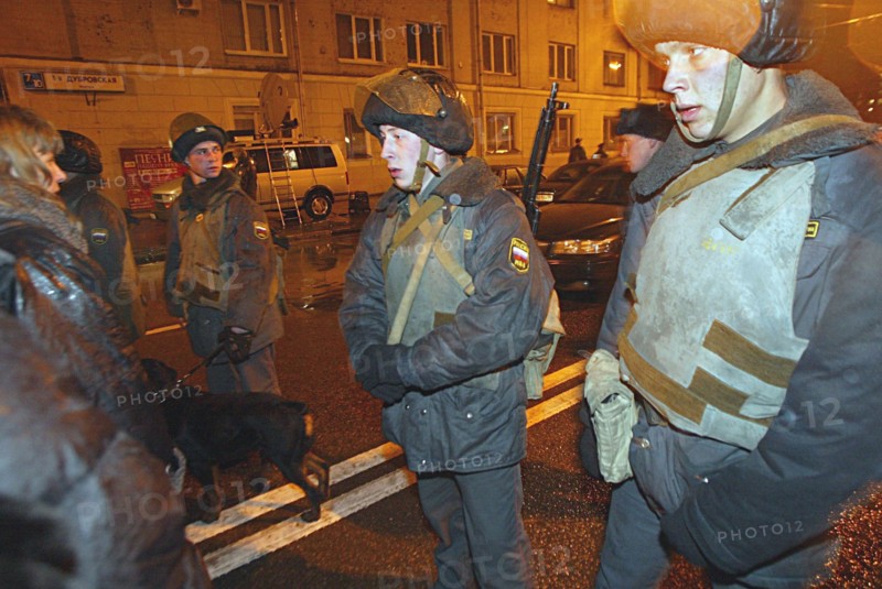Moscow, russia, october 24 2002: anti-riot policemen at the entrance to the building of the palace of culture of the ball-bearing plant which had been seized by armed terrorists, on wednesday, at 21,00 moscow time, some hundreds of hostages still remain in the building.