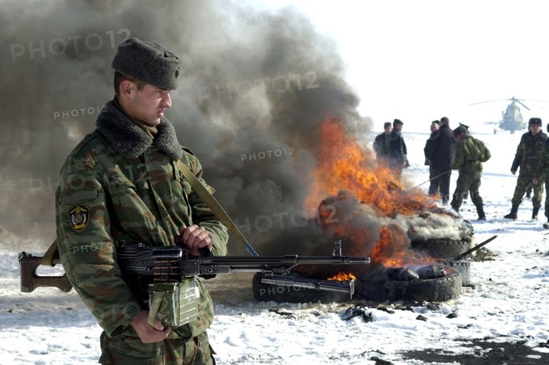 Tajikistan, december 6 2002: men of the moskovsky border detachment burning up packets containing the confiscated drugs with a total weight of 841,9 kilograms, on friday, the drugs were confiscated in the course of special operations held with the participation of over 300 servicemen, (photo sergei zhukov) .