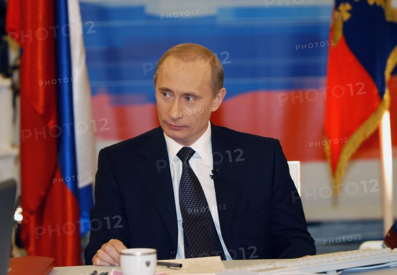 Moscow, russia, december 19, 2002, russian president vladimir putin pictured during his live tv- and radio dialogue with russians, the dialogue was broadcast live by the first tv channel, the russia tv channel, the mayak and radio russia radio broadcasting stations.