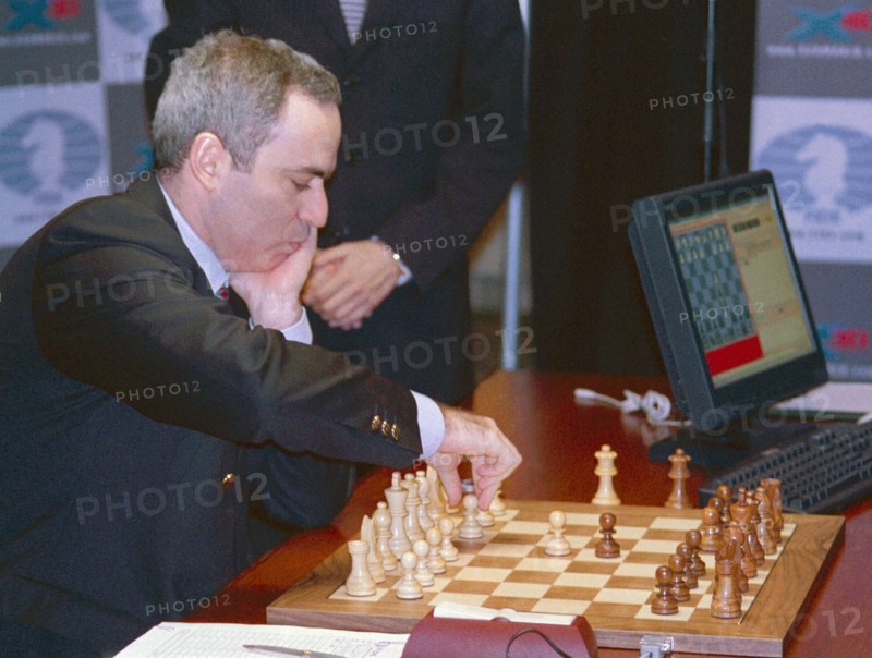 Russian chess player garry kasparov playing the white pieces in a match against the deep junior computer program, sunday, held on manhattan, it took kasparov 27 moves and almost four hours to beat deep junior in the opening round of their six-game match, new york, usa, january 27, 2003.
