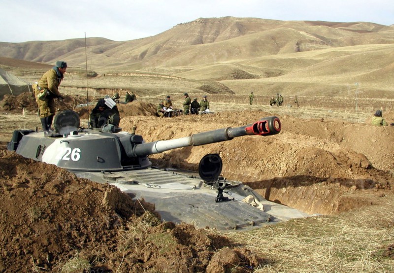 Tajikistan, february 18, 2002, servicemen of the russian 201st division pictured during the military exercises held on the 'lyaur' training range in the south of tajikistan, units of a separate batallion of the collective fast reaction force of the cis also took part in field firing manoeuvre, the troops drilled cooperation and tactics in case of penetration of large groups of terrorists to the republic's territory.