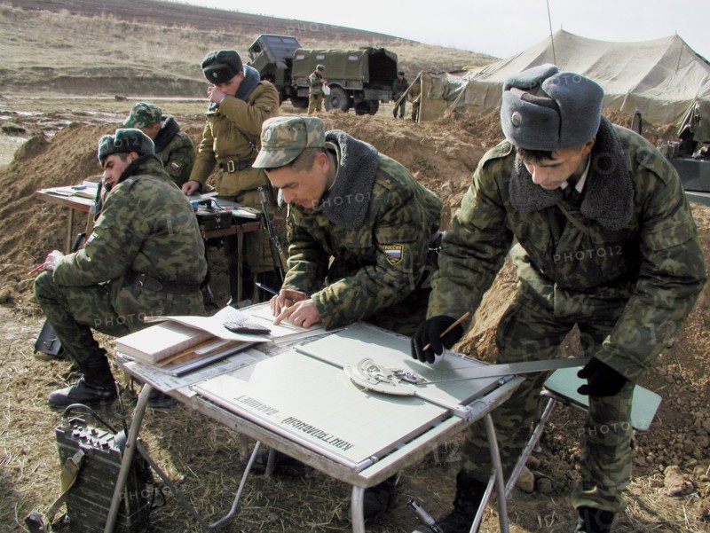 Tajikistan, february 18, 2002, servicemen of the russian 201st division pictured during the military exercises held on the 'lyaur' training range in the south of tajikistan, units of a separate batallion of the collective fast reaction force of the cis also took part in field firing manoeuvre, the troops drilled cooperation and tactics in case of penetration of large groups of terrorists to the republic's territory.