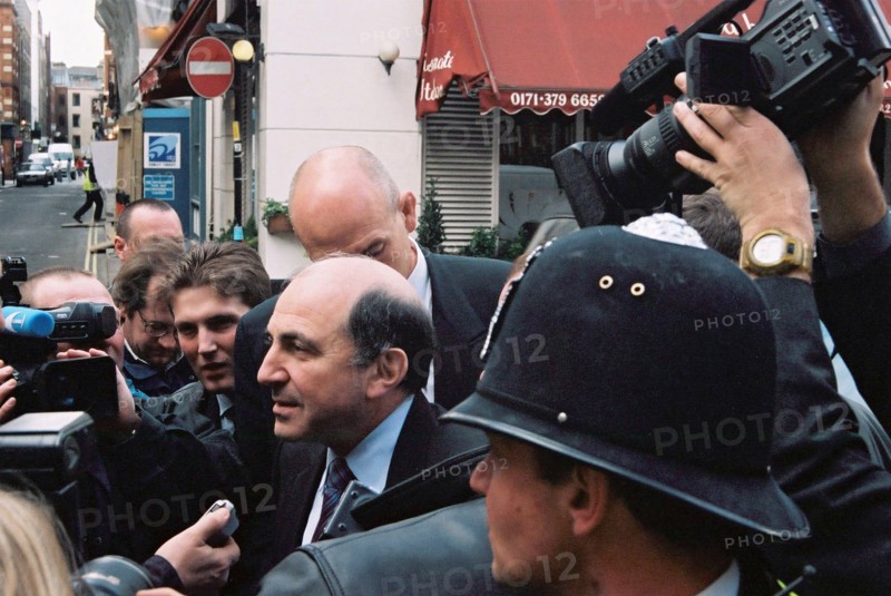 Russian business magnate boris berezovsky (c) answering journalists questions outside london's bow street magistrates court where hearing on his extradition and the extradition of yuli dubov took place on wednesday, london, uk, april 2, 2003.