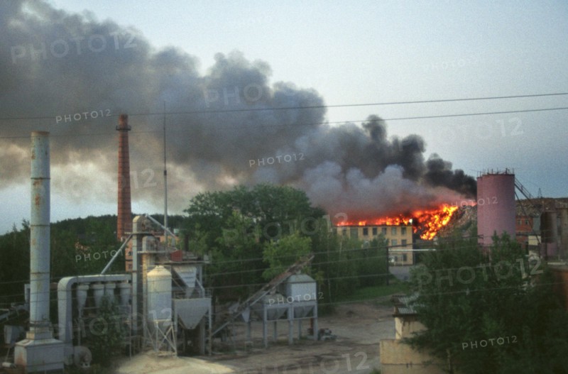 Moscow region, russia, smoke of a burning dump at the asphalt plant in domodedovo, yesterday cloaked the whole town, the ecological situation in moscow suburbs keeps deteriorating, 08,2003.