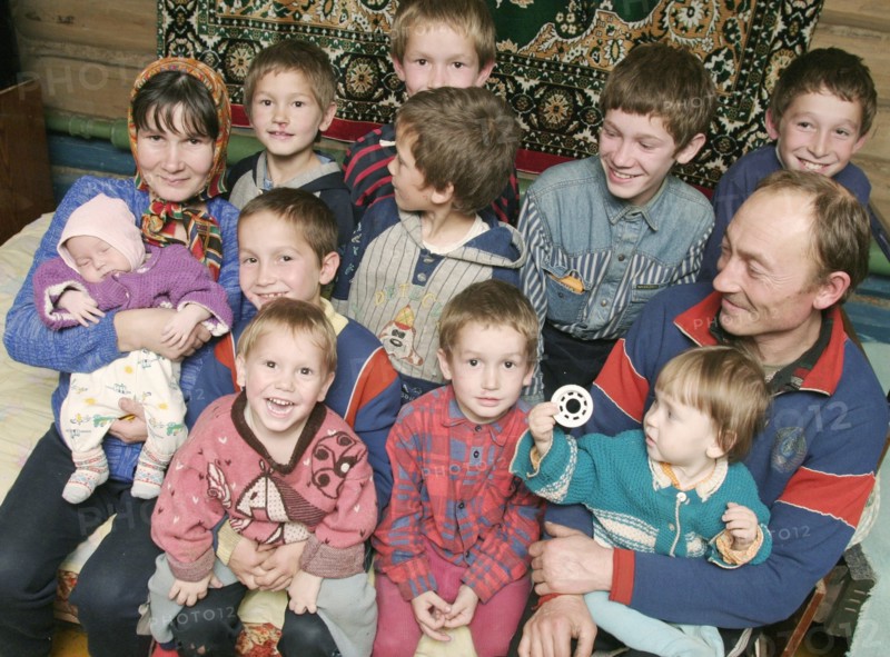 Chuvashia, siberia, russia, october 25 2003, chuvash family living in poverty, mother valentina pours soup for father leonid and their children, there are ten boys in the family, the elder is 13 years old and the youngest is only three weeks old.