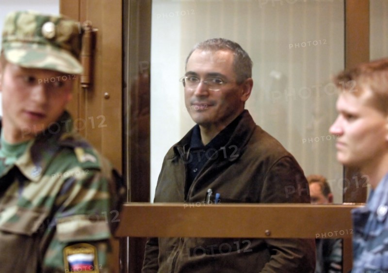 Former head of yukos mikhail khodorkovsky leaving the courtroom after hearing that the moscow city court has reduced his and p, lebedev's sentences from 9 to 8 years of imprisonment, moscow, russia, september 22, 2005.