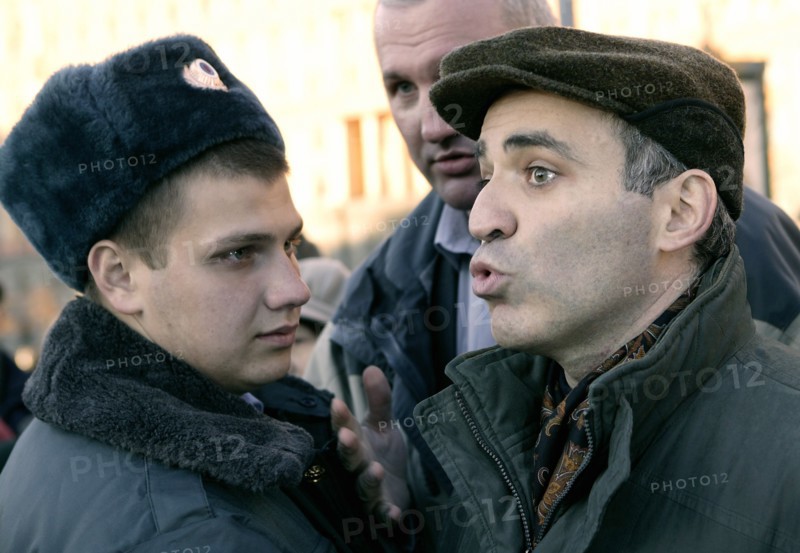 Garry kasparov (right), leader of the united civil front, is pictured at the “protest march of those who disagree” at the stone from solovki (a monument to the victims of gulag) in lubyanka square (where the kgb headquarters were located), moscow, russia, october 30 2005, the protest march was organized by garry kasparov’s united civil front.