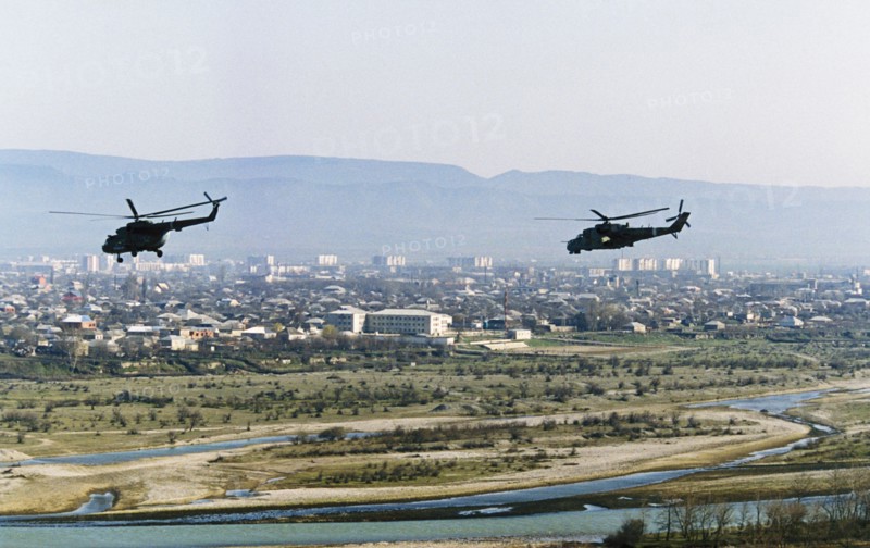 Russian military helicopters flying over gudermes, chechnya during the second chechen war, april 4, 2000.