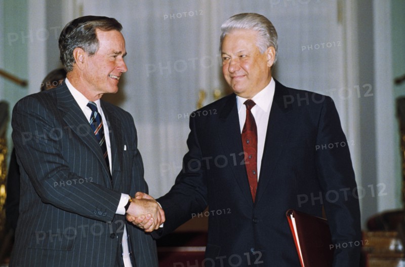 Presidents george bush and boris yeltsin shaking hands after signing the strategic arms limitation treaty (salt ll) in january 1993, moscow, russia.