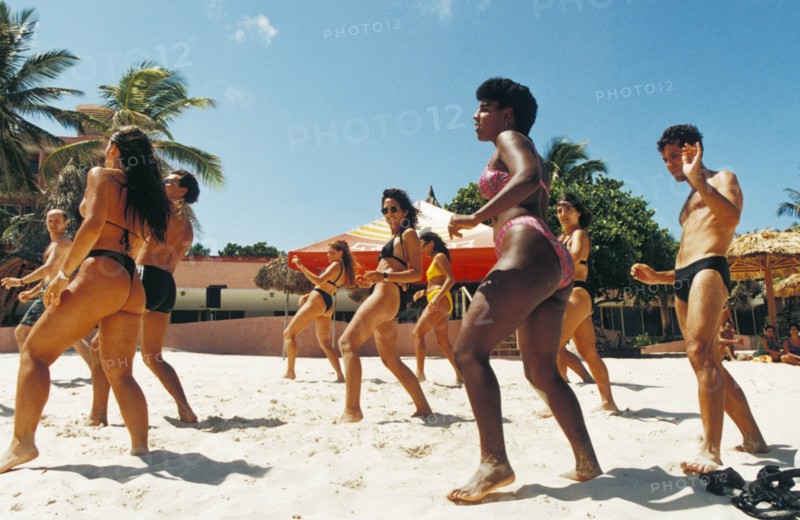 A dance class being held on the beach at a resort on varadero beach, cuba.