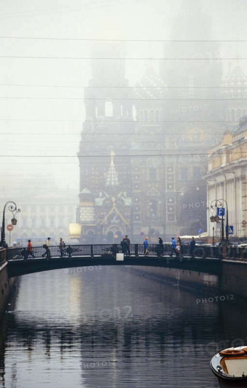 Italian bridge over st, catherine's canal in st, petersburg, russia on a foggy day, 1999, the church of our savior on the spilled blood is beyond.