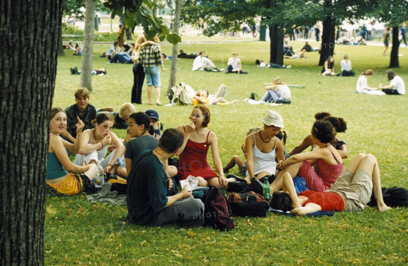 Young muscovites enjoying the summer weather in alexander garden near the kremlin wall, 2000s.