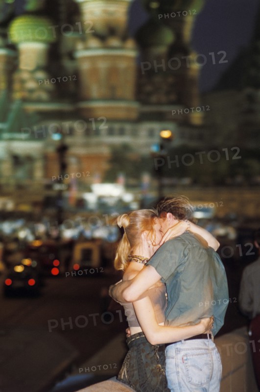 A young couple kissing in red square, moscow, 1997.
