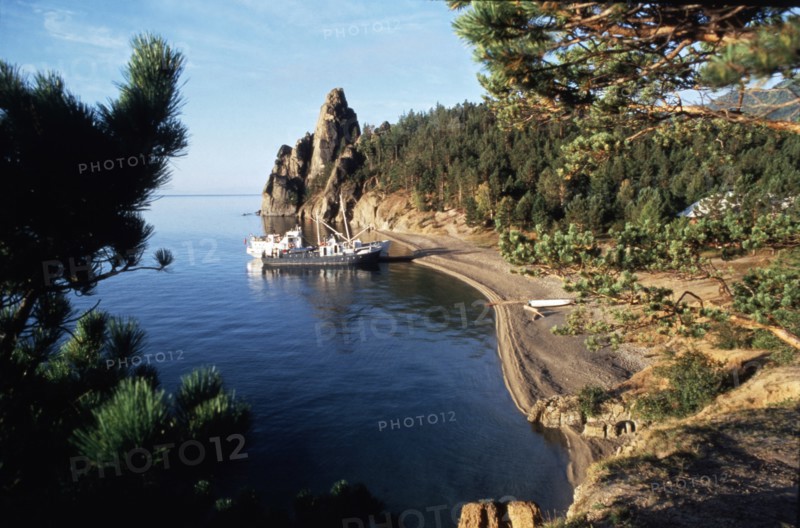 Fishing boats along the shore of lake baikal in the irkutsk region of siberia, russia.