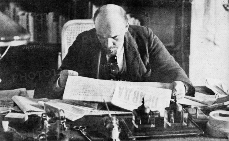 Lenin in his office in the Kremlin, reading Pravda. 1921