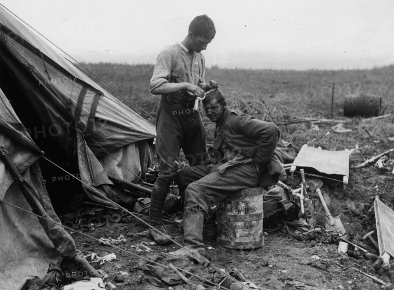 Dressing the wounds of a German prisoner.