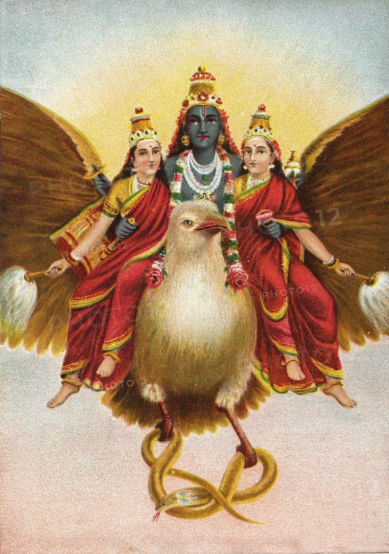 God Vishnu rides on his vehicle Garuda with two wives
