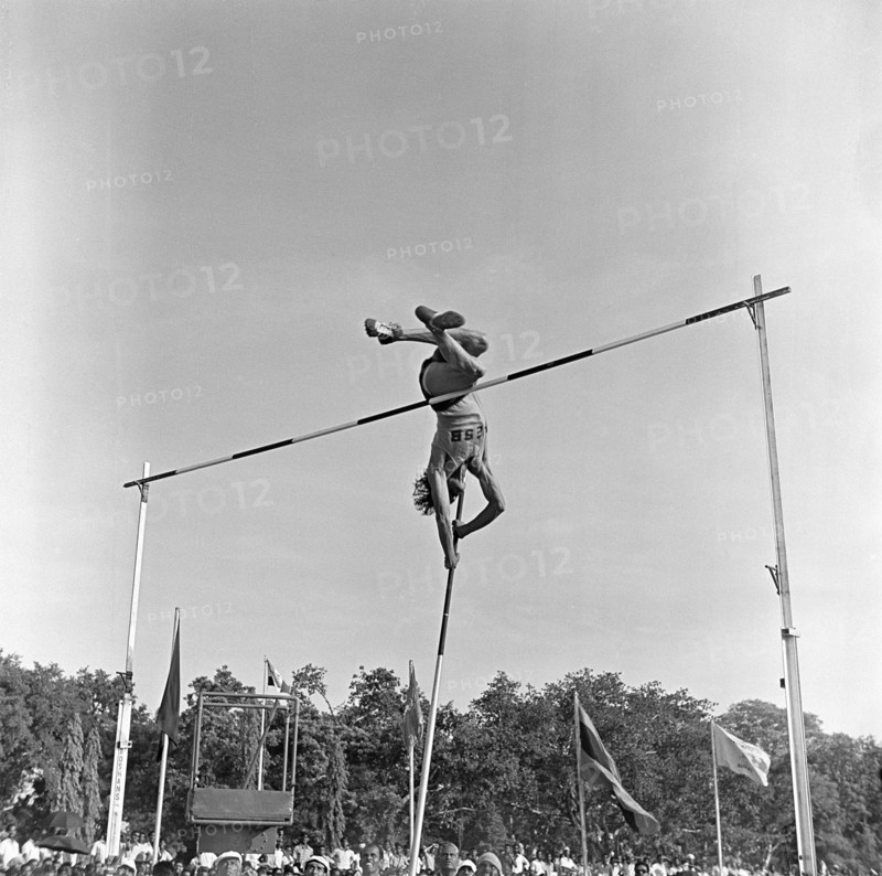 South Asian Indian athlete performing Pole Vault