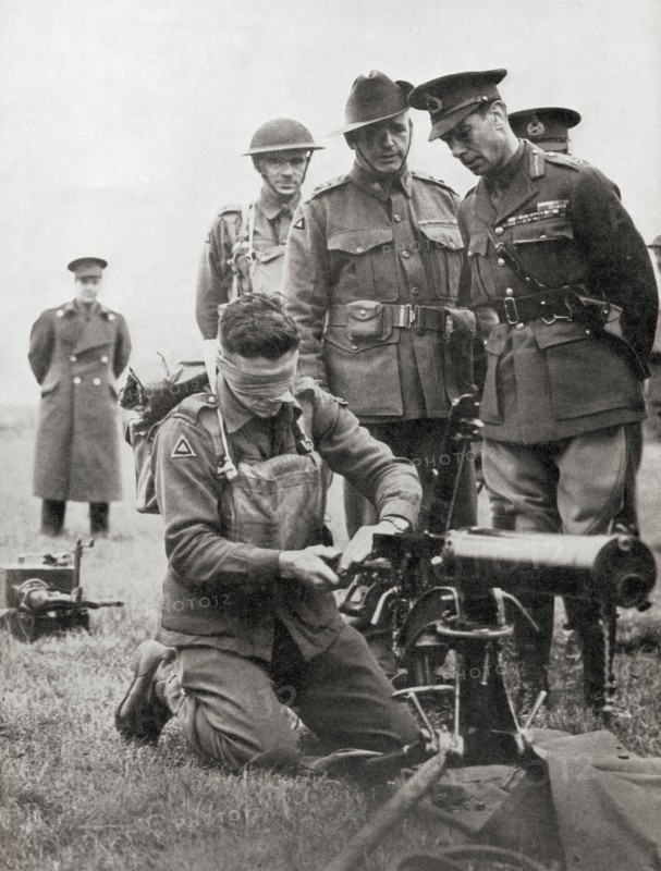 King George VI watching a blindfolded Australian soldier assemble a machine gun