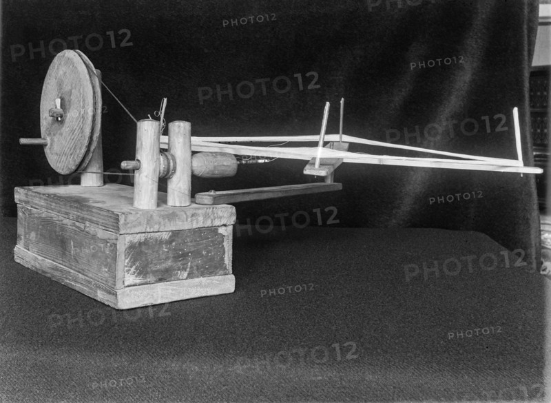 Black and white image of an apparatus used for sewing