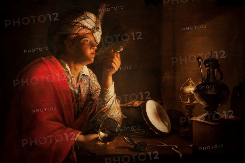 Young man smoking a pipe