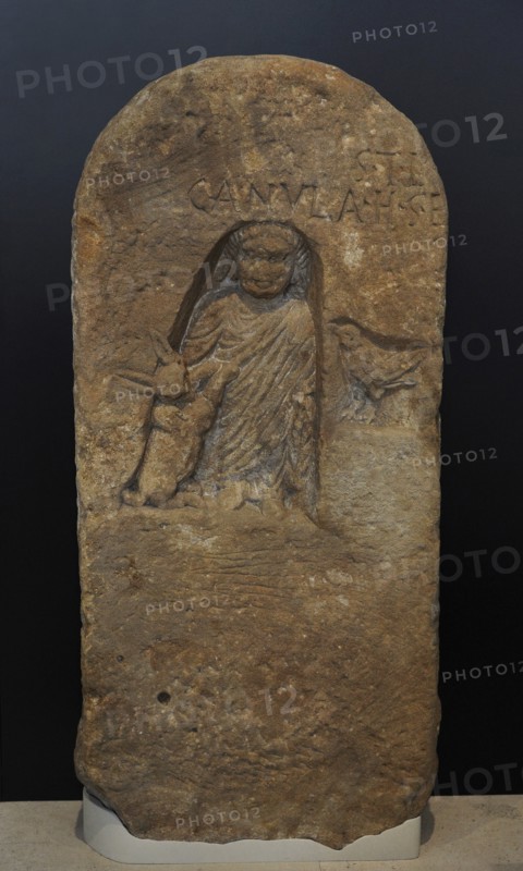 Roman funerary stele dedicated to a deceased girl, depicted in a niche with a full-length tunic and a cloak