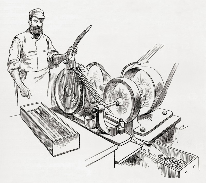 A worker at a coin rimming machine, the Royal Mint, London,