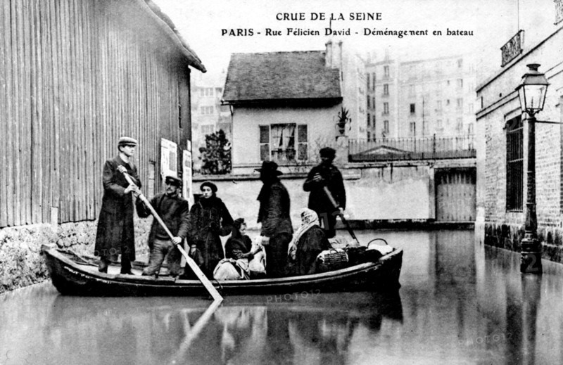 Flood in paris in 1910, removal by boat in félicien david street, . it was a catastrophe in which the seine river carried winter rains. the level rose eight meter above normal. 1910 flood in paris in 1910
