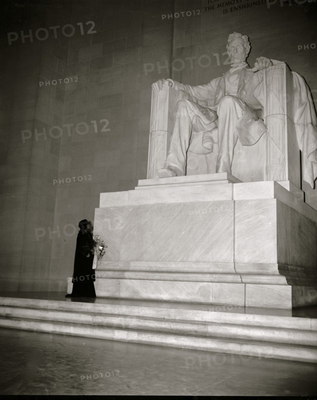 Marion Anderson before a statute of President Lincoln in the Memorial in DC