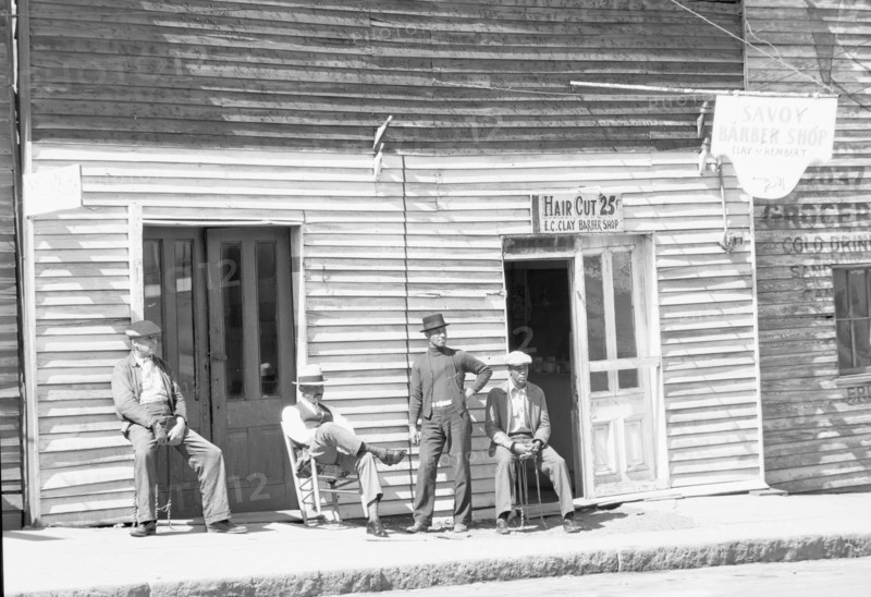 Vicksburg Negroes and shop front. Mississippi