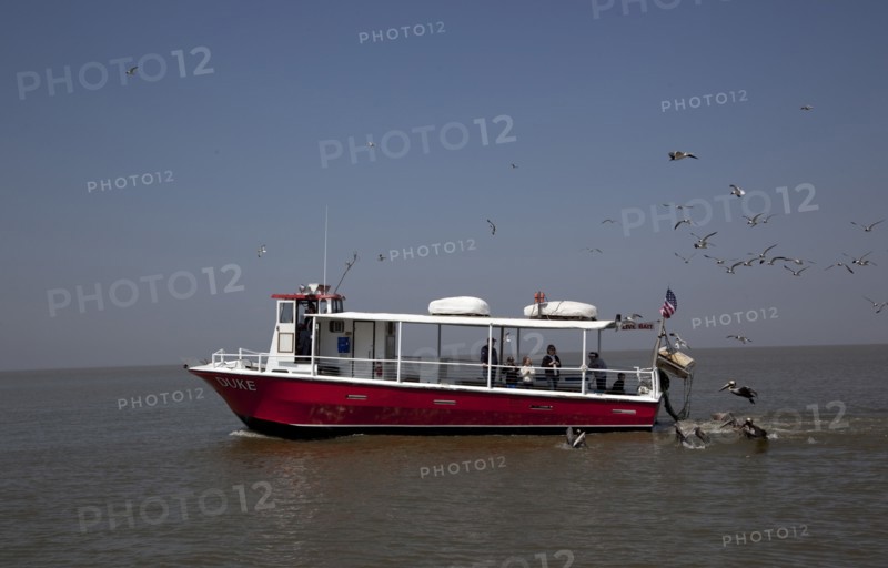 Ferries, boats and oil rigs all co-exist on Mobile Bay in Alabama