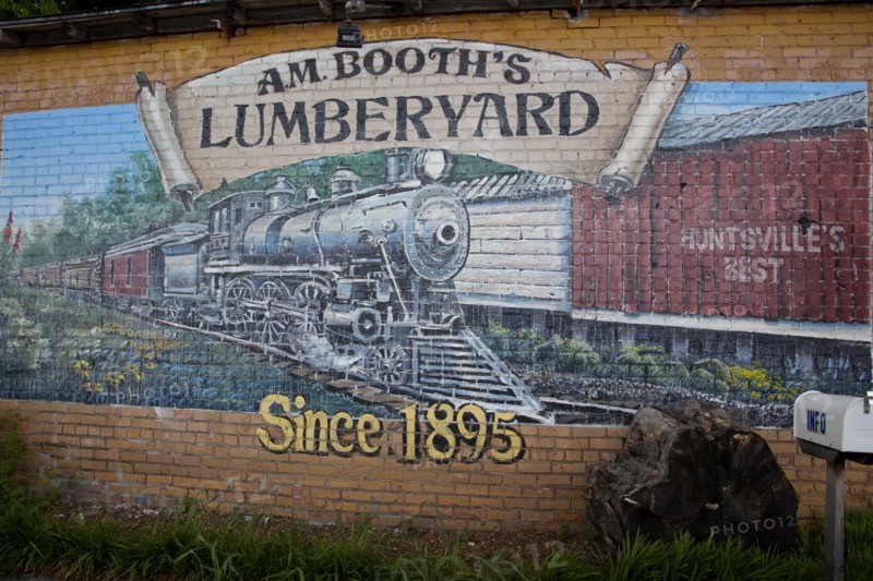 A.M. Booth's lumberyard mural in of train