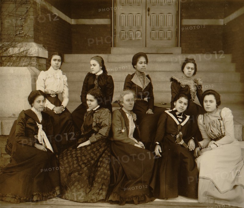 Nine African American women, full-length portrait, seated on steps of a building at Atlanta University, Georgia