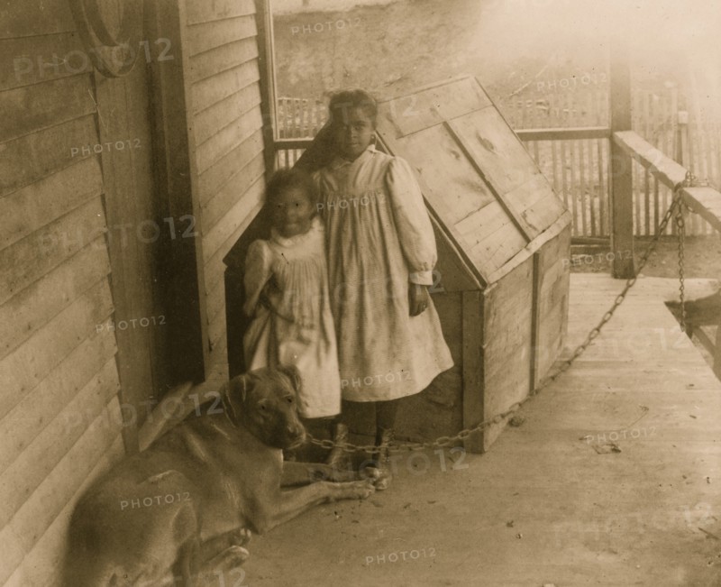 Two African American children with a dog in Georgia