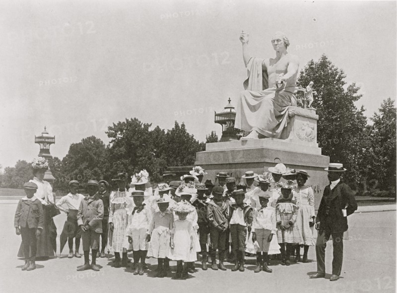 Group of school children in front of statue of George Washington, Washington, D.C.