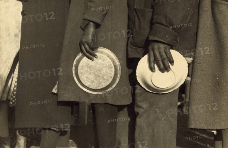African Americans in the lineup for food in the camp for flood refugees