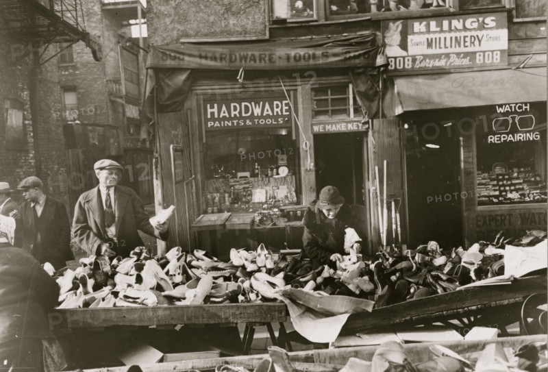 People shopping for shoes at shop on Maxwell Street, Chicago, Illinois