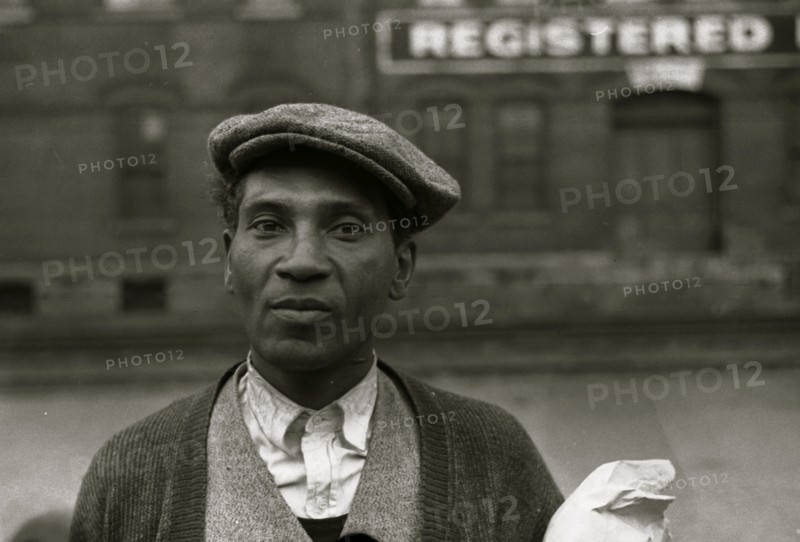 Negro waiting for freight train to leave Dubuque, Iowa