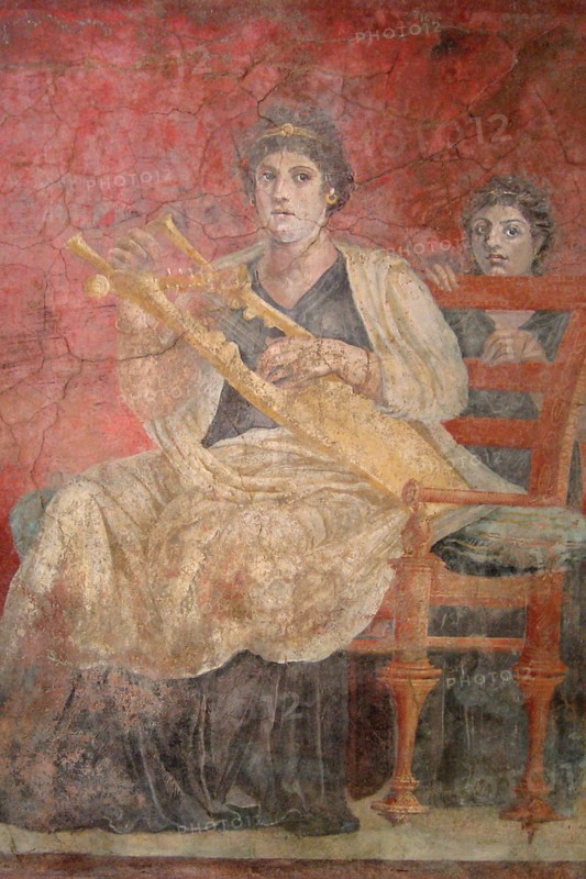 Seated woman playing a kithara