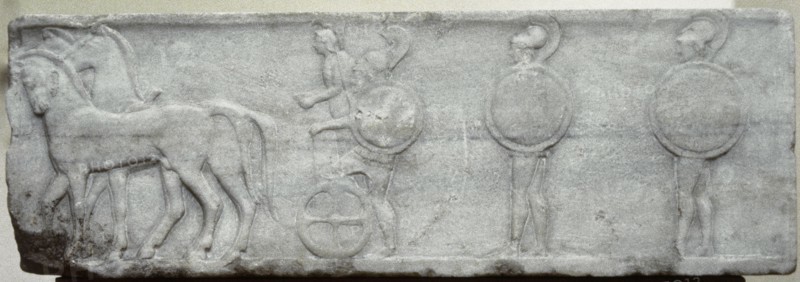 Base of funerary Kouros. Four-horse chariot and hoplites.