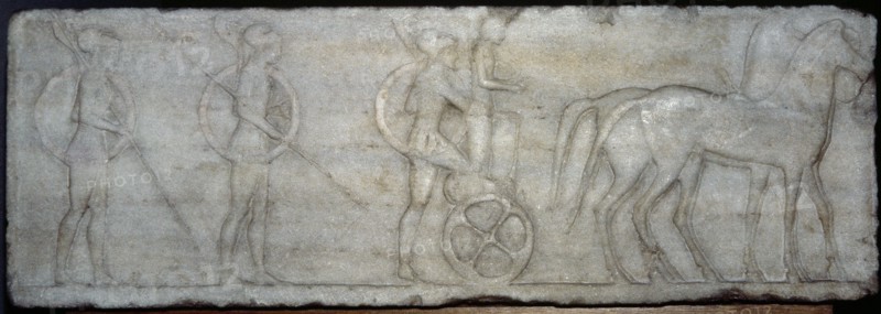 Base of funerary Kouros. Four-horse chariot and hoplites.