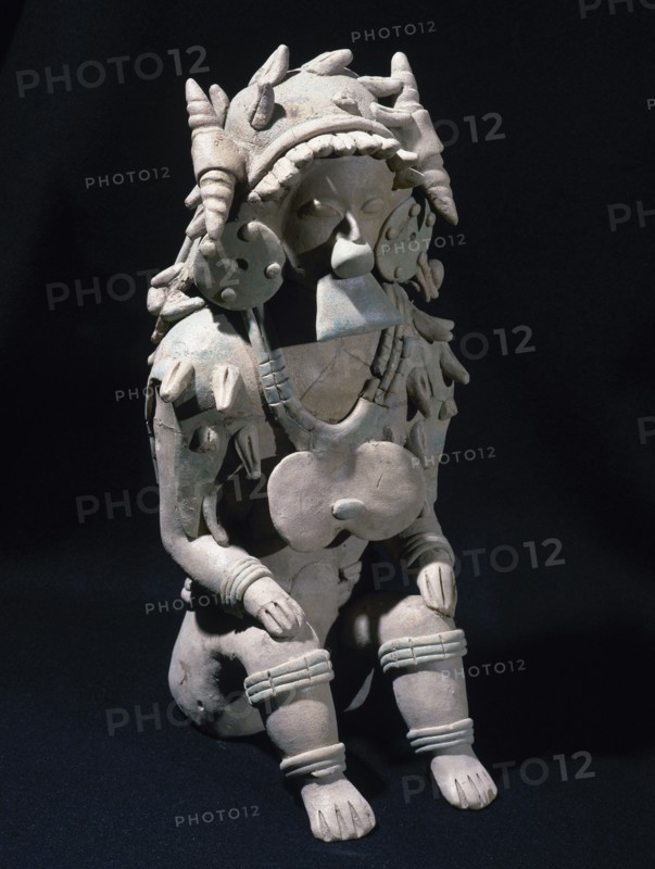 Male figure sitting.