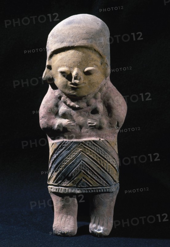 Female figure with polychrome remains.